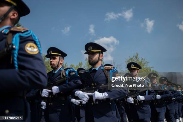 Members of the Iranian Army's air force are marching in a military parade to mark the anniversary of Iran's Army Day at an Army military base in...