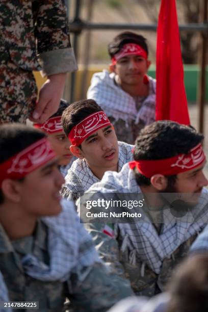 Members of the Basij paramilitary force are preparing to march in a military parade marking Iran's Army Day anniversary at an Army military base in...