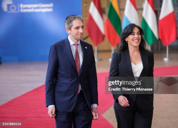 Irish Taoiseach Simon Harris and his Minister of State for European Affairs Jennifer Carroll MacNeill arrive for an EU Summit in the Europa building,...