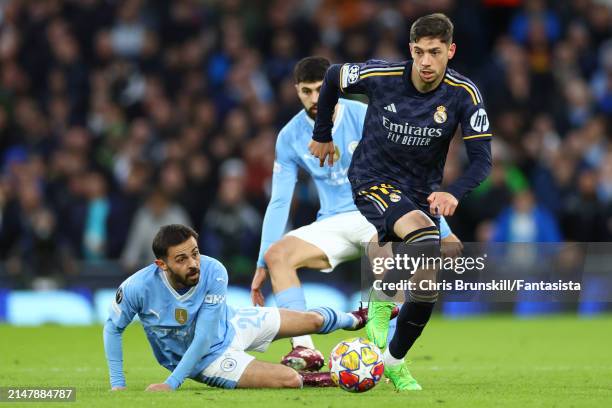 Bernardo Silva of Manchester City competes with Federico Valverde of Real Madrid during the UEFA Champions League quarter-final second leg match...
