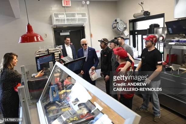 President Joe Biden greets employees at a Sheetz gas station in Pittsburgh, Pennsylvania, on April 17, 2024. Biden is urging a tripling of tariffs on...