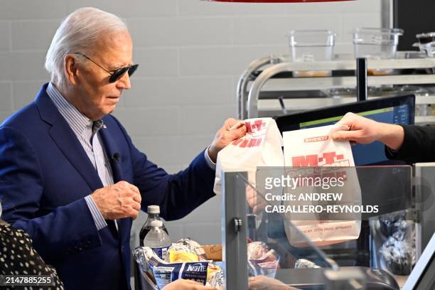 President Joe Biden buys food at a Sheetz gas station in Pittsburgh, Pennsylvania, on April 17, 2024. Biden is urging a tripling of tariffs on...