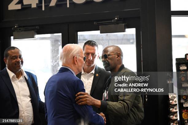President Joe Biden greets a patron at a Sheetz gas station in Pittsburgh, Pennsylvania, on April 17, 2024. Biden is urging a tripling of tariffs on...
