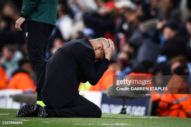 Manchester City's Spanish manager Pep Guardiola reacts following a missed chance during the UEFA Champions League quarter-final second-leg football...