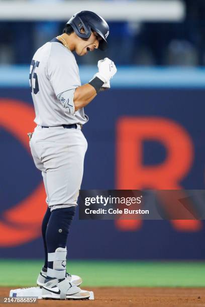 Oswaldo Cabrera of the New York Yankees celebrates on base as he hits a double in the fifth inning of their MLB game against the Toronto Blue Jays at...