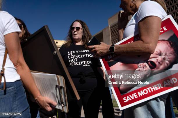 Anti-abortion advocates demonstrate prior to an Arizona House of Representatives session at the Arizona State Capitol on April 17, 2024 in Phoenix,...