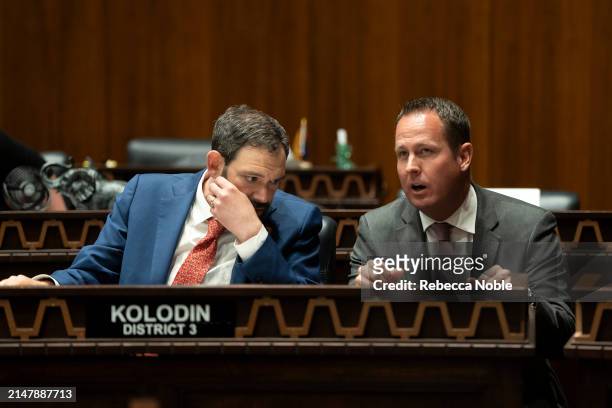 Arizona State Reps. Alex Kolodin, left, and Travis Grantham, right, speak during a legislative session at the Arizona House of Representatives on...