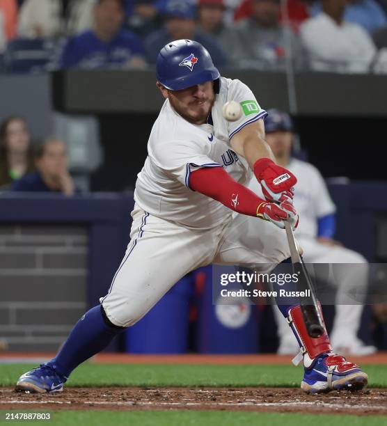 Toronto Blue Jays catcher Alejandro Kirk fouls off a pitch as the Toronto Blue Jays play the New York Yankees at Rogers Centre in Toronto. April 17,...