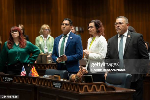 Arizona State Reps. And Assistant Minority Leader Oscar De Los Santos, Minority Whip Nancy Gutierrez and Minority Leader Lupe Contreras stand during...