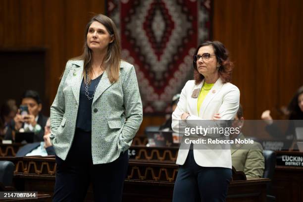 Arizona State Reps. Stephanie Stahl Hamilton and Minority Whip Nancy Gutierrez listen during a legislative session at the Arizona House of...