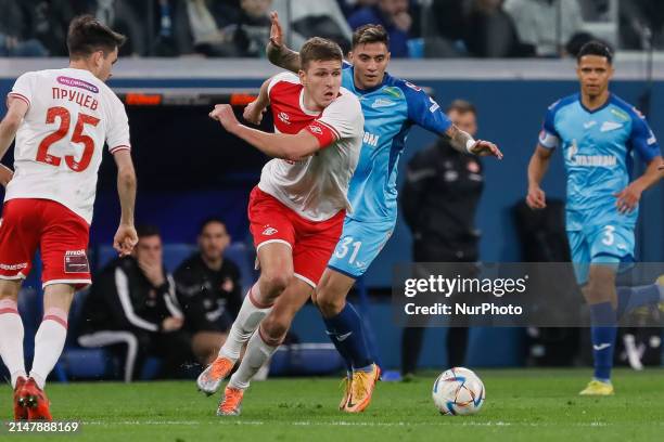 Gustavo Mantuan of Zenit St. Petersburg and Aleksandr Sobolev of Spartak Moscow vie for the ball during the Russian Cup match between FC Zenit Saint...