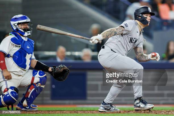 Alex Verdugo of the New York Yankees hits a double in the ninth inning of their MLB game against the Toronto Blue Jays at Rogers Centre on April 17,...