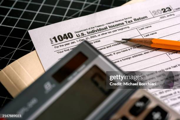 In this photo illustration, a 1040 U.S. Individual Income Tax Return document is seen on a desk on April 15, 2024 in North Haledon, New Jersey.