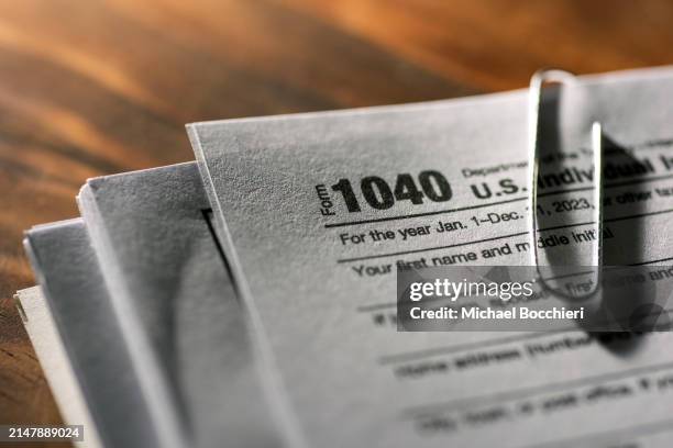 In this photo illustration, a 1040 U.S. Individual Income Tax Return document is seen on a desk on April 15, 2024 in North Haledon, New Jersey.