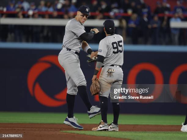 New York Yankees outfielder Aaron Judge celebrates the win with New York Yankees third base Oswaldo Cabrera as the Toronto Blue Jays play the New...