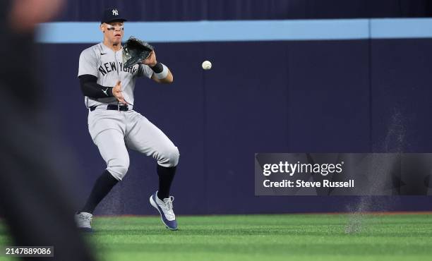 New York Yankees outfielder Aaron Judge fields a Toronto Blue Jays outfielder Kevin Kiermaier ninth inning single as the Toronto Blue Jays play the...