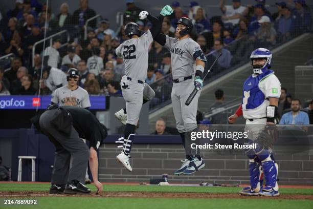 New York Yankees outfielder Juan Soto celebrates an eighth inning home run with New York Yankees outfielder Aaron Judge as the Toronto Blue Jays play...