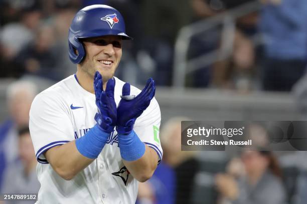 Toronto Blue Jays outfielder Daulton Varsho gestures after hitting his second home run of the game as the Toronto Blue Jays play the New York Yankees...