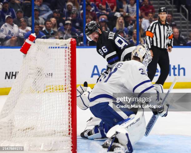 Nikita Kucherov of the Tampa Bay Lightning scores against goalie Martin Jones of the Toronto Maple Leafs during the first period at Amalie Arena on...