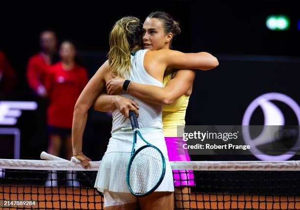 Paula Badosa of Spain and Aryna Sabalenka embrace after Badosa was forced to retire from their second-round match on day three of the Porsche Tennis...