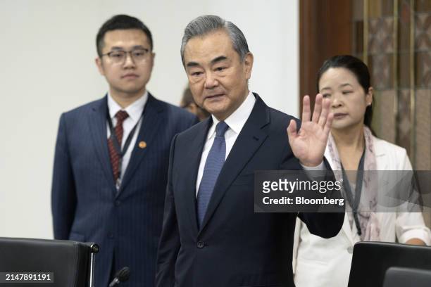 Wang Yi, China's foreign minister, center, arrives for a bilateral meeting with Retno Marsudi, Indonesia's foreign affairs minister, not...
