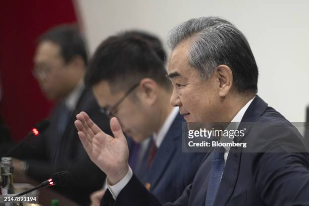 Wang Yi, China's foreign minister, right, speaks to Retno Marsudi, Indonesia's foreign affairs minister, not photographed, during a bilateral meeting...