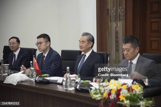 Wang Yi, China's foreign minister, center, speaks to Retno Marsudi, Indonesia's foreign affairs minister, not photographed, during a bilateral...