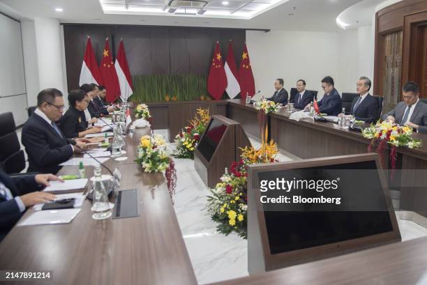Wang Yi, China's foreign minister, second right, and Retno Marsudi, Indonesia's foreign affairs minister, second from left, during a bilateral...