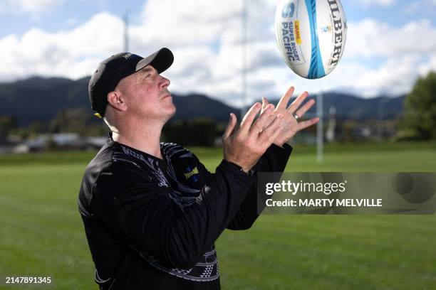 Hurricanes head coach Clark Laidlaw plays with a rugby ball at the New Zealand Campus of Innovation and Sport rugby training camp in Upper Hutt on...