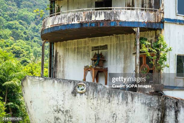 Buddhist altar is seen on the deck of The Galaxy abandoned ship hotel, on Koh Chang Island. The "Galaxy Hotel" is a seven-story cruise ship that was...