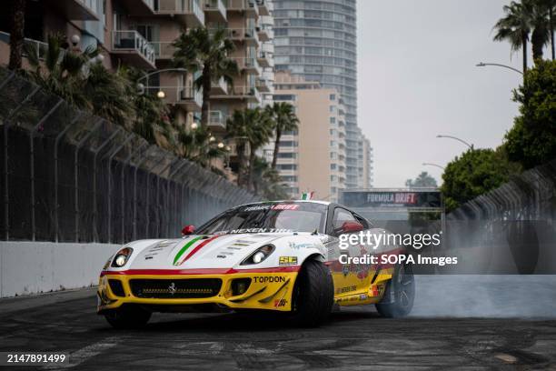 Federico Sceriffo driver of the lone Ferrari, warms his tires before practice runs on day one. Formula Drift is back for another year of competition,...