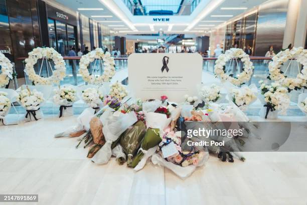 Flowers are left at Westfield Bondi Junction during a day of reflection on April 18, 2024 in Bondi Junction, Australia. The Westfield Bondi Junction...