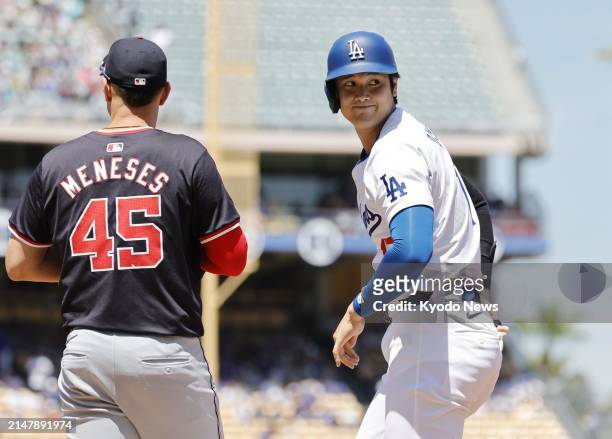 Shohei Ohtani of the Los Angeles Dodgers is pictured after hitting a single in the first inning of a baseball game against the Washington Nationals...