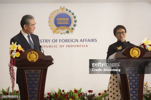 Wang Yi, China's foreign minister, left, and Retno Marsudi, Indonesia's foreign affairs minister, during a news conference in Jakarta, Indonesia, on...