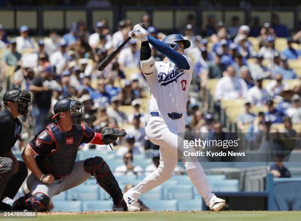 Shohei Ohtani of the Los Angeles Dodgers hits a single in the first inning of a baseball game against the Washington Nationals on April 17 at Dodger...