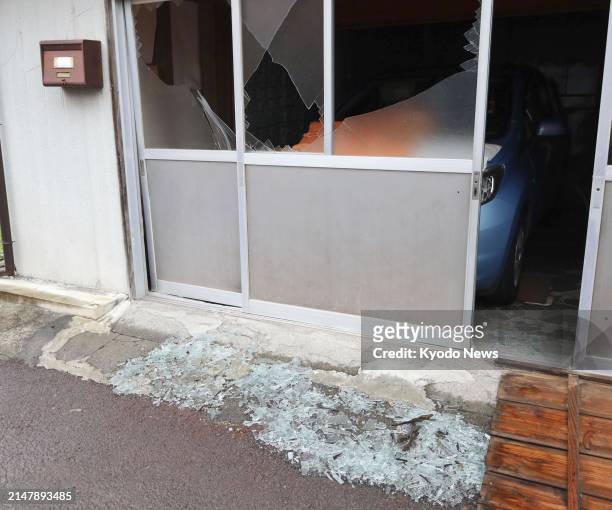 Photo taken April 18 shows a house with a broken window in Sukumo in Kochi Prefecture, western Japan, after an earthquake with a magnitude of 6.6 hit...