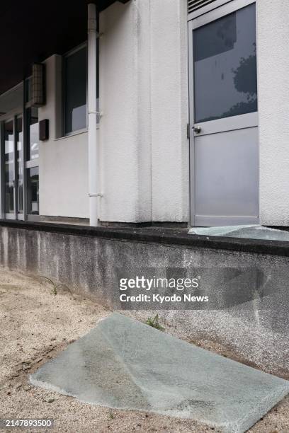 Photo taken April 18 shows a fallen glass window at an elementary school in Ainan in Ehime Prefecture, western Japan, after an earthquake with a...