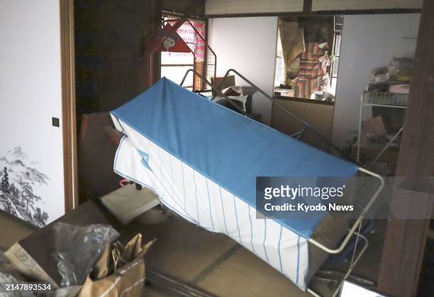 Photo taken April 18 shows a fallen shelf at a house in Sukumo in Kochi Prefecture, western Japan, after an earthquake with a magnitude of 6.6 hit a...