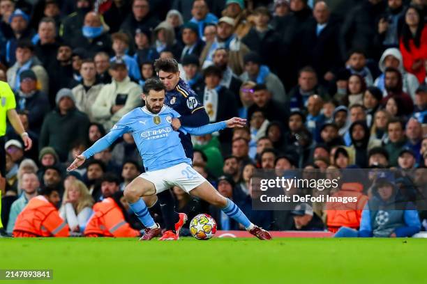 Bernardo Silva of Manchester City and Brahim Diaz of Real Madrid battle for the ball during the UEFA Champions League quarter-final second leg match...