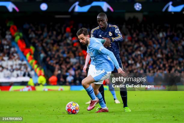 Bernardo Silva of Manchester City and Ferland Mendy of Real Madrid battle for the ball during the UEFA Champions League quarter-final second leg...
