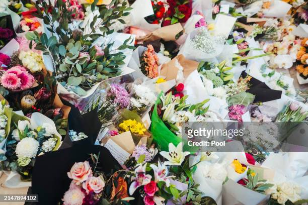 Flowers and gifts are laid at the Westfield Bondi Junction shopping centre during a day of reflection on April 18, 2024 in Bondi Junction, Australia....
