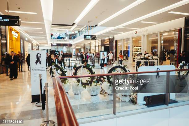 Members of the public pay their respects at the Westfield Bondi Junction shopping centre during a day of reflection on April 18, 2024 in Bondi...