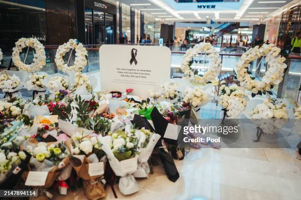 Flowers and gifts are laid at the Westfield Bondi Junction shopping centre during a day of reflection on April 18, 2024 in Bondi Junction, Australia....