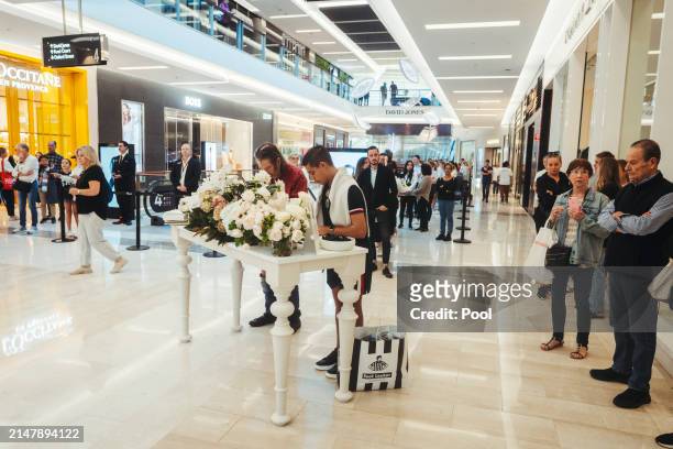 Members of the public pay their respects at the Westfield Bondi Junction shopping centre during a day of reflection on April 18, 2024 in Bondi...