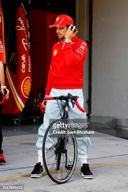 Charles Leclerc, Scuderia Ferrari, with a bicycle in the pit lane during previews ahead of the F1 Grand Prix of China at Shanghai International...