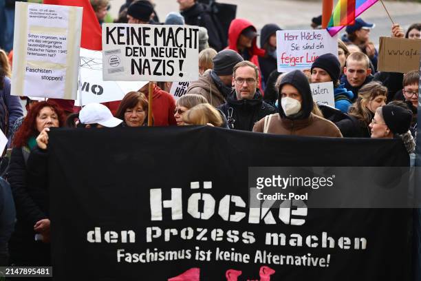 Protesters with banners reading "Bring Hoecke to trial - Fascism is not alternative!" stand near the courthouse on April 18, 2024 in Halle, Germany....