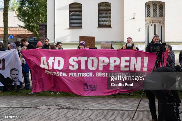 Protesters gather outside the courthouse as Bjoern Hoecke, a former history teacher and current leader of the far-right Alternative for Germany...