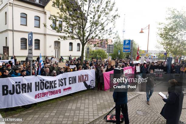 Protesters gather outside the courthouse as Bjoern Hoecke, a former history teacher and current leader of the far-right Alternative for Germany...