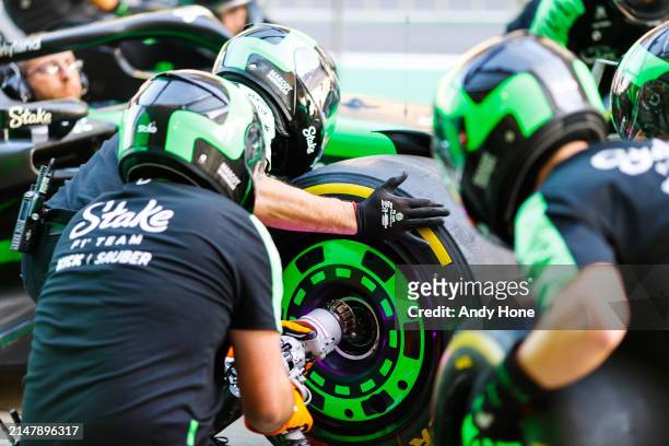 Members of the pit crew of the Stake F1 Team Kick Sauber practice their pit stops during previews ahead of the F1 Grand Prix of China at Shanghai...