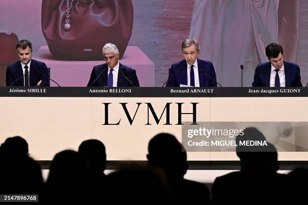 French world's top luxury group LVMH CEO Bernard Arnault , flanked by chairman of the executive committee Antonio Belloni , financial director...